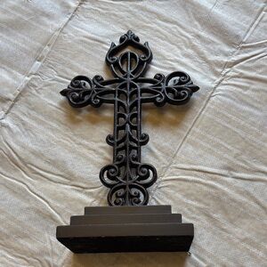 Black cast iron cross on pedastal